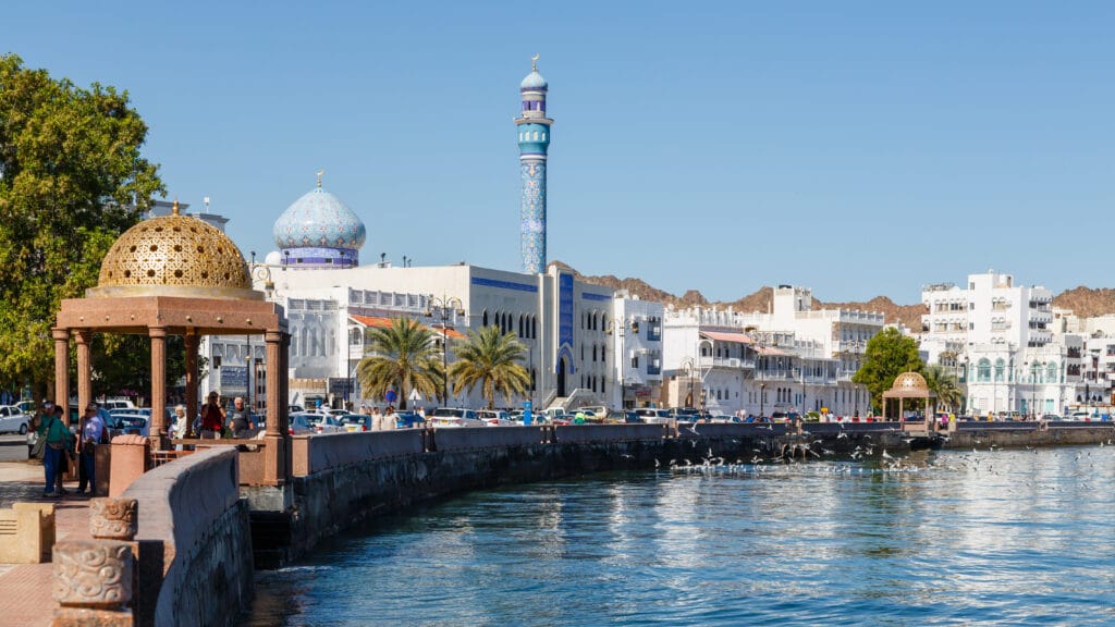 Muscat's Muttrah corniche and harbour beneath the mountains, Oman