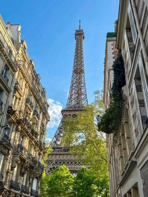 The Eiffel Tower seen from a classic Parisian street, France
